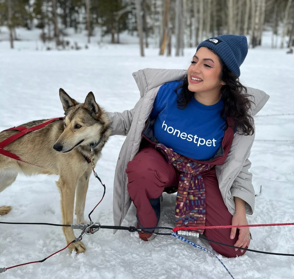 HonestPet team member with rescued dog in winter